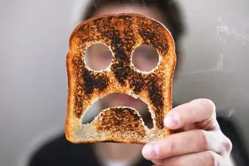 burnt toast with frown face