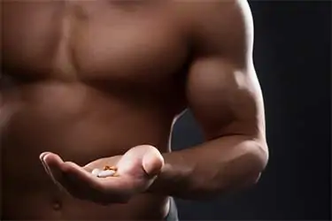 athlete holding supplements