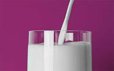 pouring milk in glass