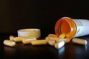 prescription bottle with pills