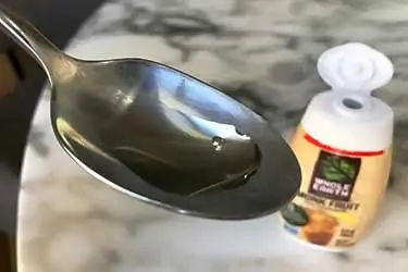 spoon of liquid monk fruit syrup