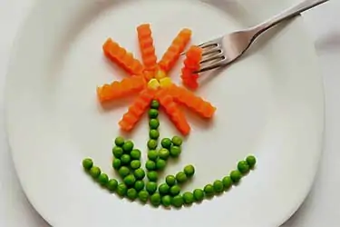 light meal of peas and carrots on plate