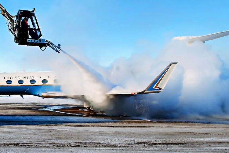 plane being de-iced with propylene glycol spray