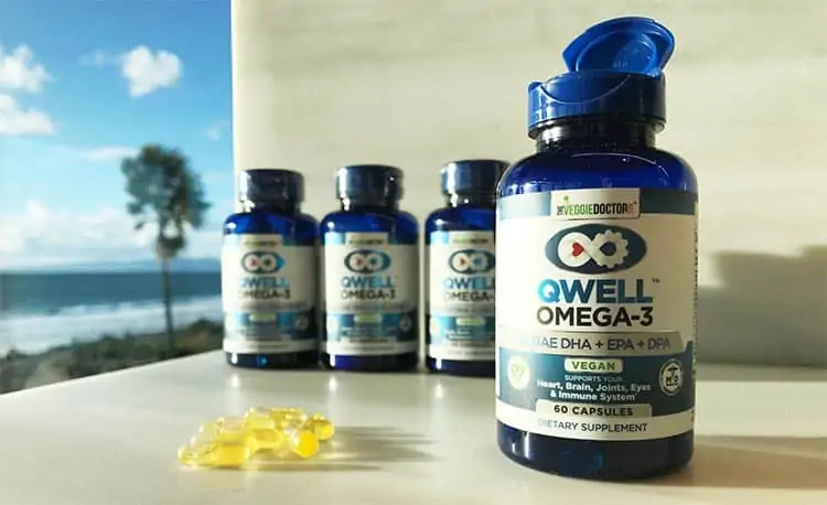 bottles of Qwell omega 3 veggie capsules on countertop